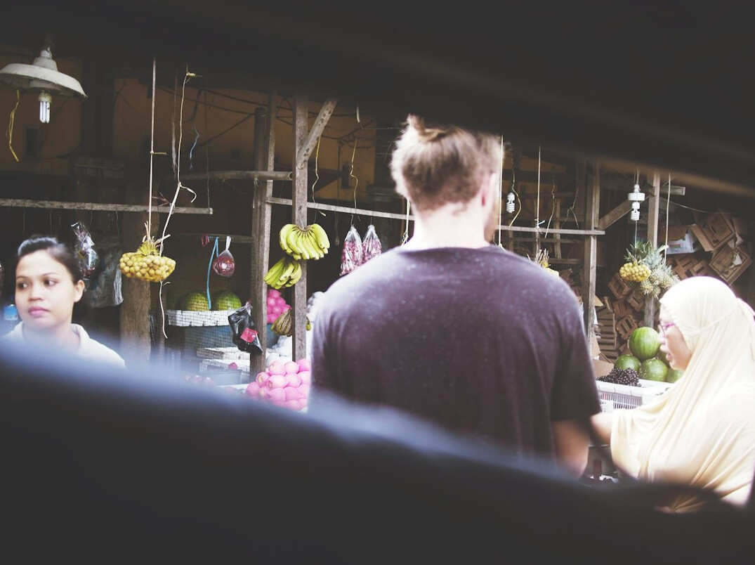 people chatting in market